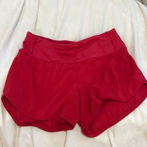 Red Lululemon running shorts